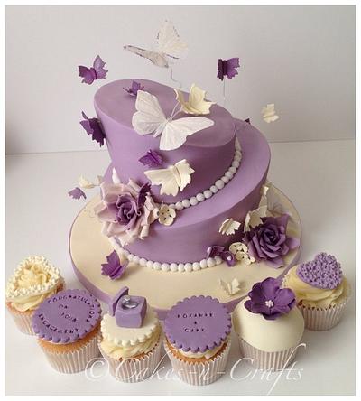 2 tier topsy turvy engagement cake and cupcakes - Cake by June milne