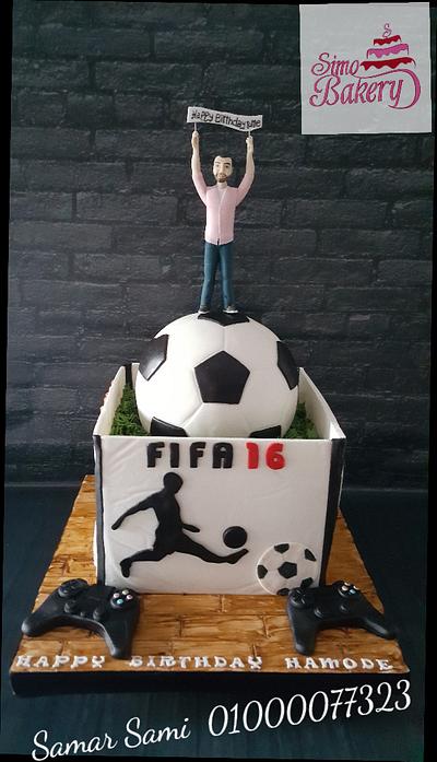 Soccer ball and playstation box cake . - Cake by Simo Bakery