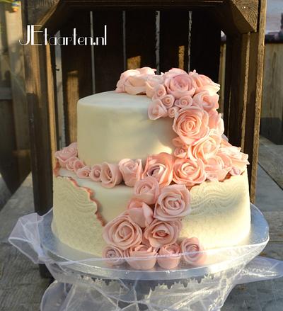 Wedding cake with lots of pink marzipan roses - Cake by Judith-JEtaarten