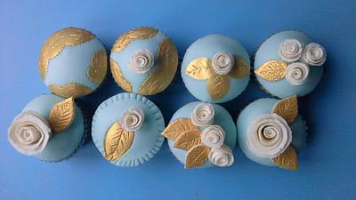 duck egg blue and gold hand painted cupcakes.  - Cake by relly