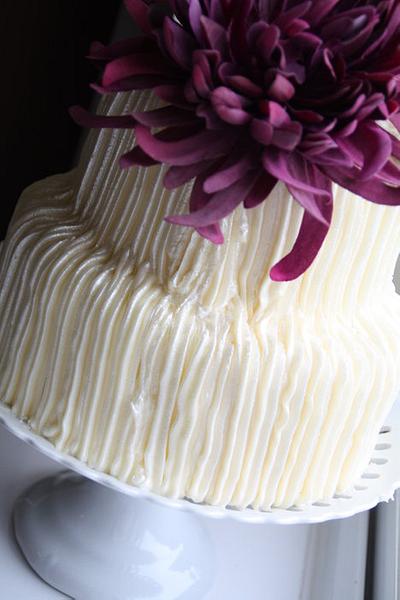 Butter iced two tier with purple flower - Cake by Ballderdash & Bunting