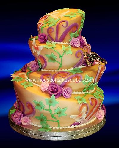 Topsy Turvy cake in gold and purple - Cake by The House of Cakes Dubai