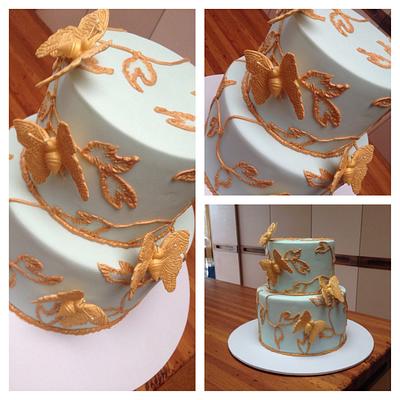 Mint with gold piping and butterflies  - Cake by Bianca Marras