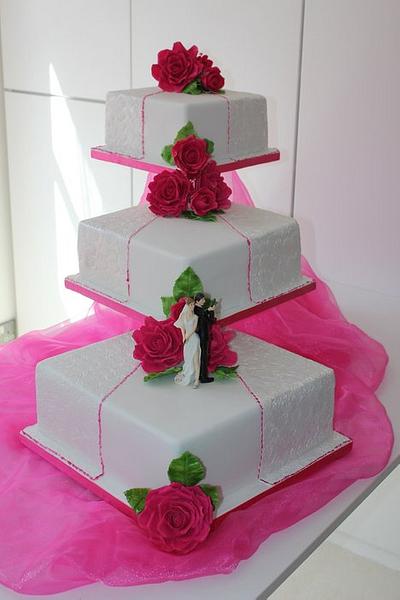 3 Tier square embossed wedding cake with Hot pink handmade roses - Cake by Cakes o'Licious