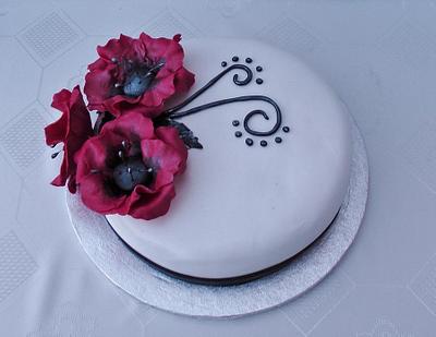poppy cake - Cake by Planet Cakes