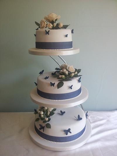 Ivory Roses and Navy butterflies Wedding Cake - Cake by Teresa Bryant