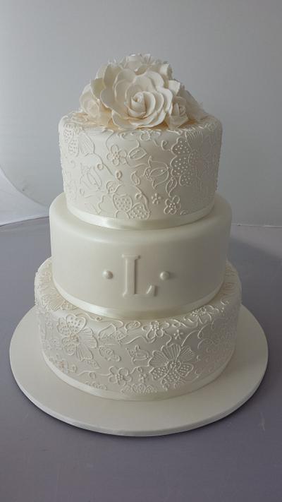 3 teir wedding cake with free hand piping. - Cake by Paul Delaney of Delaneys cakes