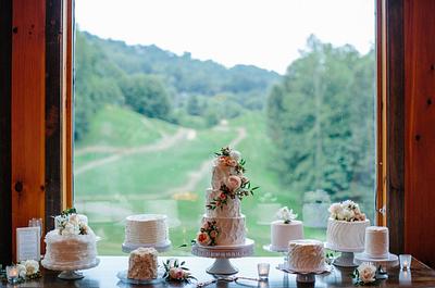 Wedding cake table of a variety of cakes.   - Cake by JustSimplyDelicious