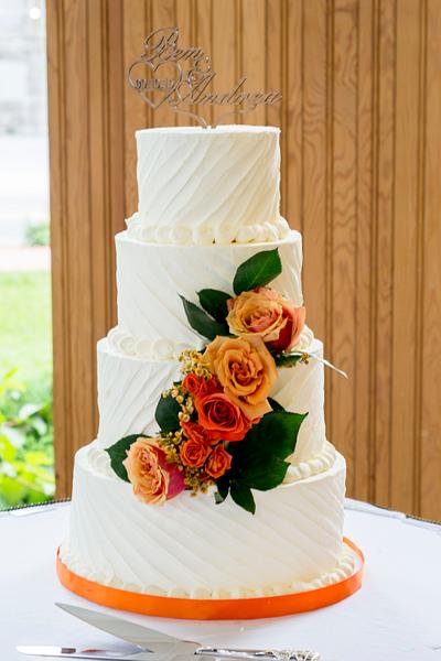 textured buttercream wedding with fresh rose cascade  - Cake by Piece O'Cake 
