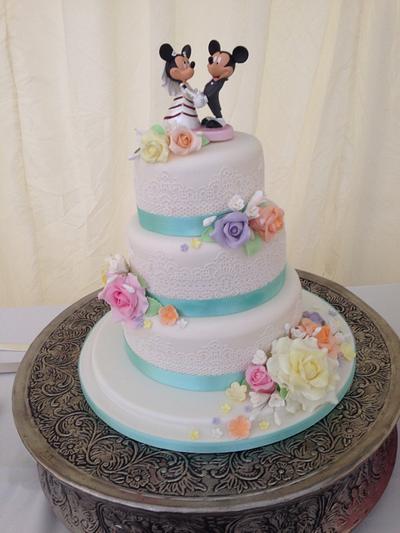 Pastel wedding cake with Mickey and minnie bride and groom  - Cake by Donnajanecakes 