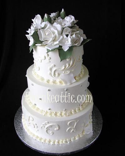 Buttercream wedding cake with scroll work and sugar roses  - Cake by Soraya Avellanet