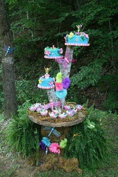 Tinkerbell and her fairy friends on a cool cakestand in the garden :) - Cake by Cakes By Julie