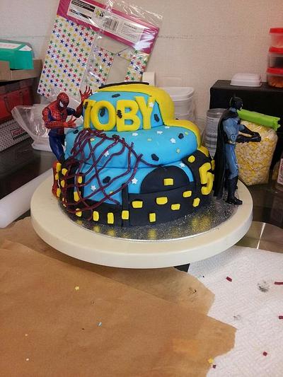 1st attempt at a batman and spiderman cake with cake pops to match. - Cake by sinisterbaker
