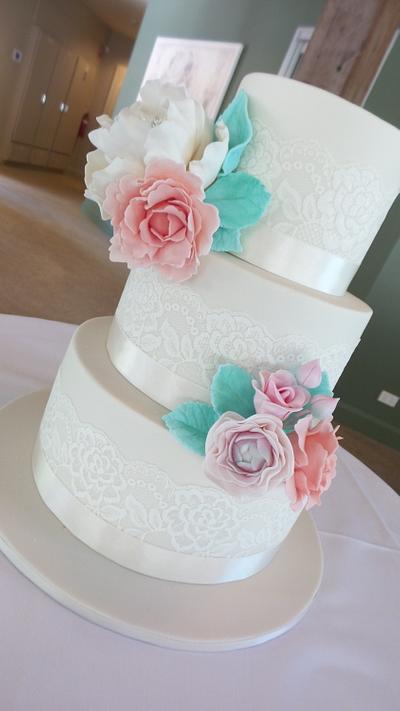 Ivory tiers with pastel blooms... - Cake by Sweet Bea's