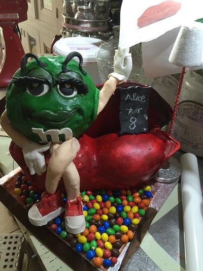 Miss green M &M on lips sofa - Cake by Yetticakes