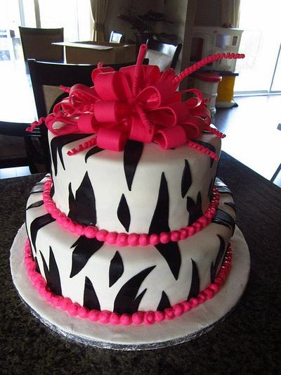 Zebra Print with hot pink pompom bow - Cake by Frostilicious Cakes & Cupcakes