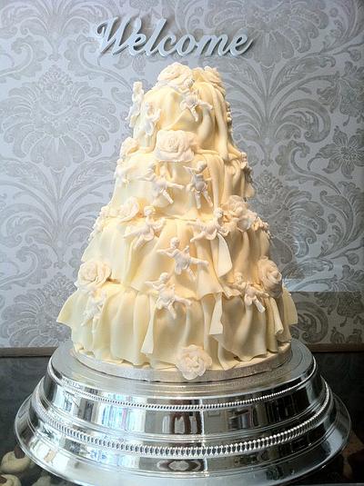 White chocolate rose and cherub frill wedding cake - Cake by Nina Stokes