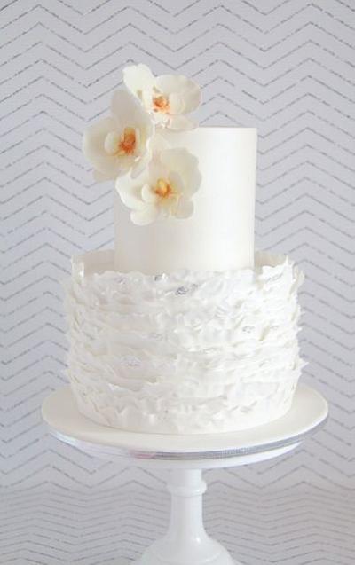 Silver leaf gilded ruffles with moth orchids - Cake by Savannah