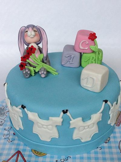 Birth cake with a baby in rabbitsuit - Cake by Alieke