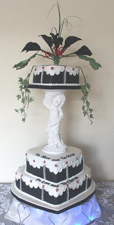 3 Tier Heart Wedding Cake with Cherub lift - Cake by Anne's Cakes For All Occasions