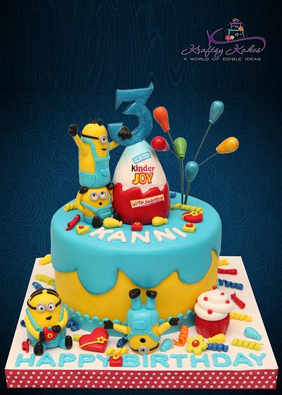 Minions Themed Cake With a Kinder Joy Surprise  - Cake by Kraftsy Kakes (Sri)