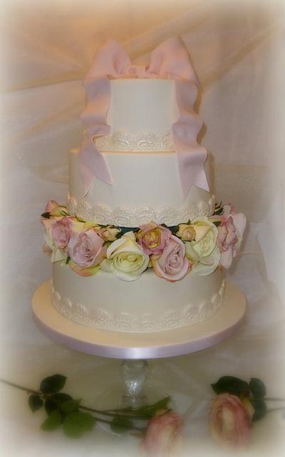 Ivory and pink bow and roses wedding cake - Cake by Janice Baybutt