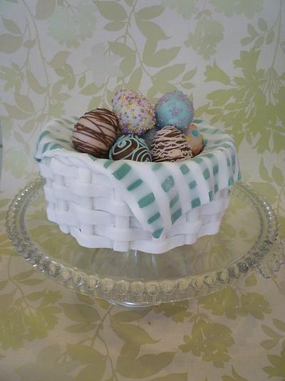 Traditional simnel cake basket with decorated cake pop eggs. - Cake by The Faith, Hope and Charity Bakery