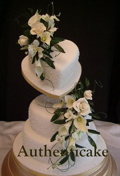 Tilted heart with side piped detail, sugar Singapore orchids and calla lilies  - Cake by Ange Cliffe