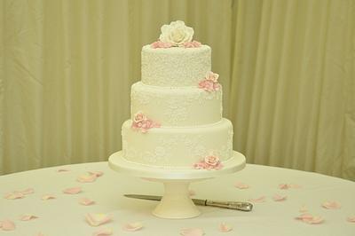 Customised piped lace wedding cake taken directly from wedding dress - Cake by Sue Field