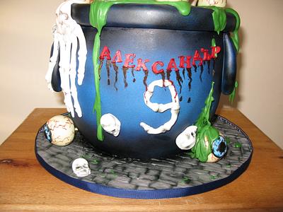 skull cake  in cauldron cake and cake pops eyes - Cake by Delice