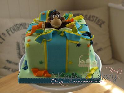 Monkey jumping out of present  - Cake by Kaylee's Cakery