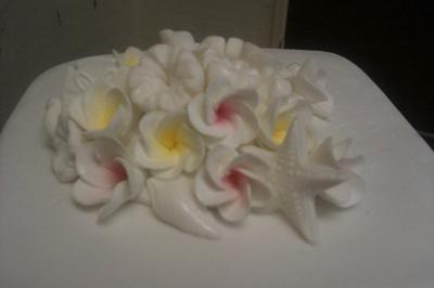 Frangipani and sea shell wedding cake - Cake by Cakemummy