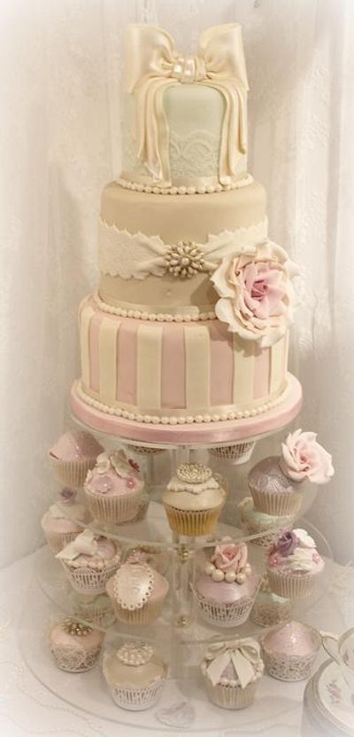 Whimsical striped cake with bow and cupcakes - Cake by Diane Hunt
