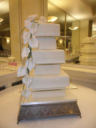 6 tier ivory wedding cake with orchid spray - Cake by elizabeth