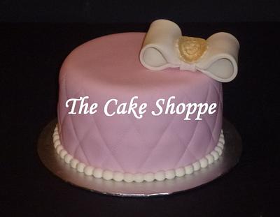 pink cake with white bow - Cake by THE CAKE SHOPPE