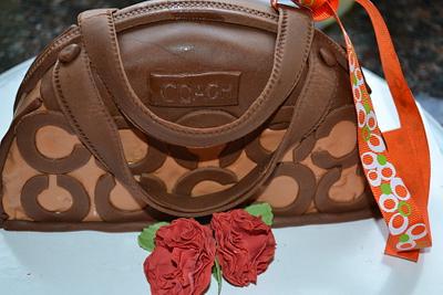 Brown coach bag and carnation. - Cake by ShrdhaSweetCreations