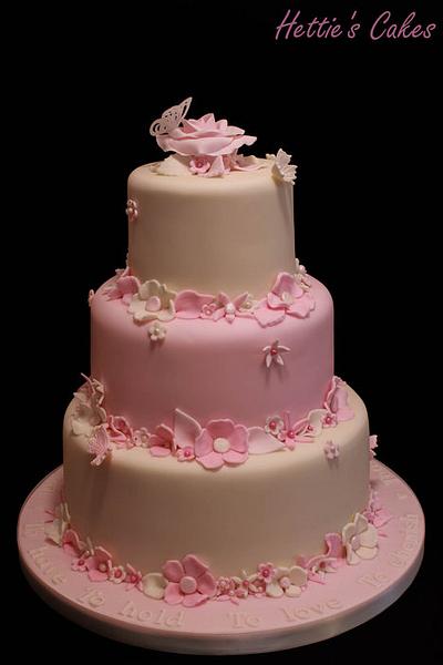 Three tier pink and ivory flowers - Cake by Hettie's Cakes