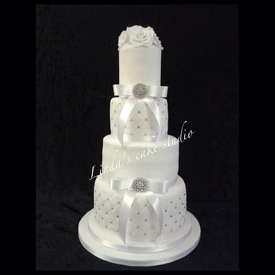 Elegant white bling 4 tier wedding cake - Cake by Linda's cake studio