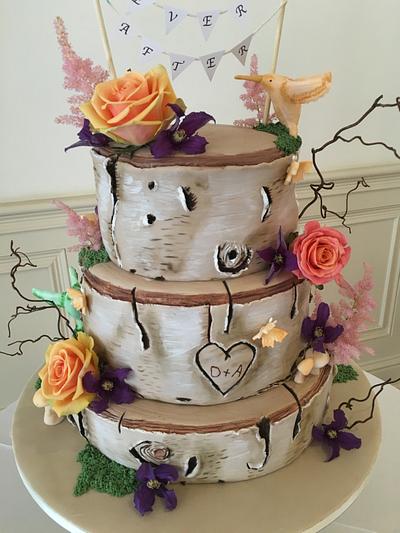Logs wedding cake, plus unicorn.  - Cake by Littlelizacakes