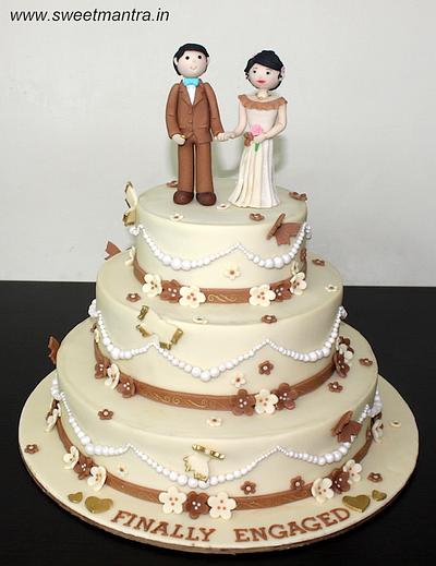 Wedding cake with couple miniature - Cake by Sweet Mantra Homemade Customized Cakes Pune