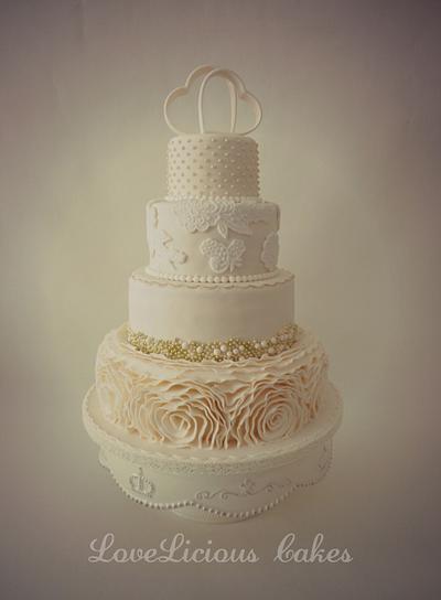 Ivory ruffle wedding cake - Cake by loveliciouscakes