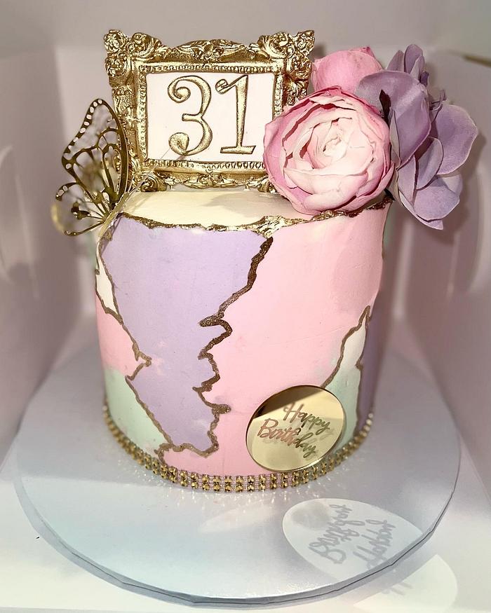 Pastel and gold marble cake