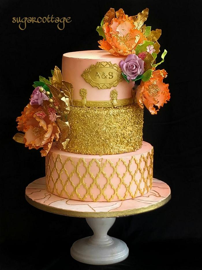 Peach and gold wedding cake
