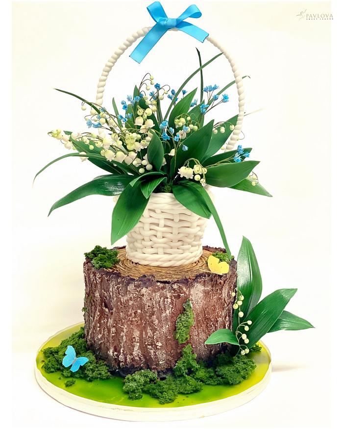 Lily of valley basket on the stump