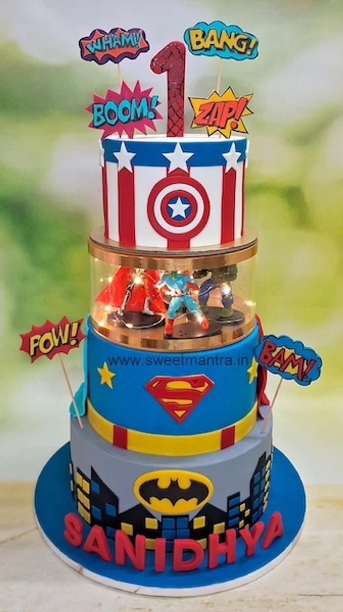 Superhero 4 tier cake with lights for 1st birthday