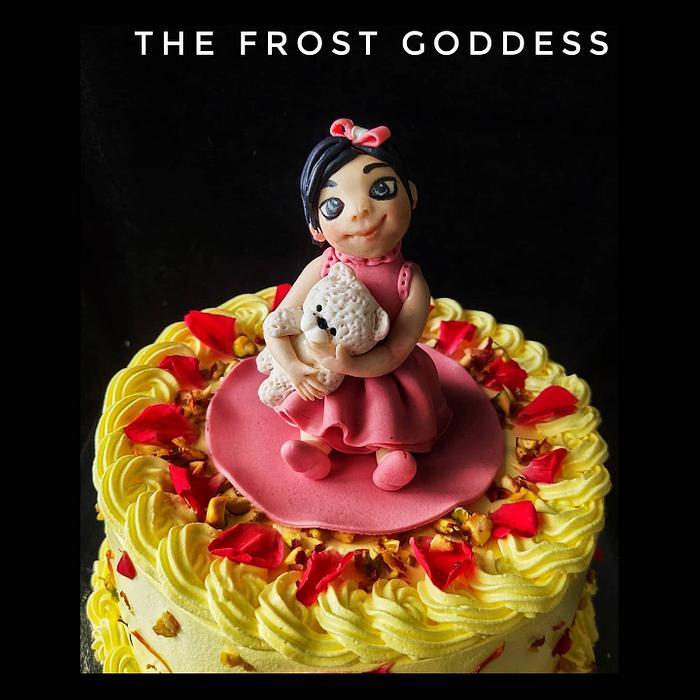 An Indian fusion cake with Lil girl topper