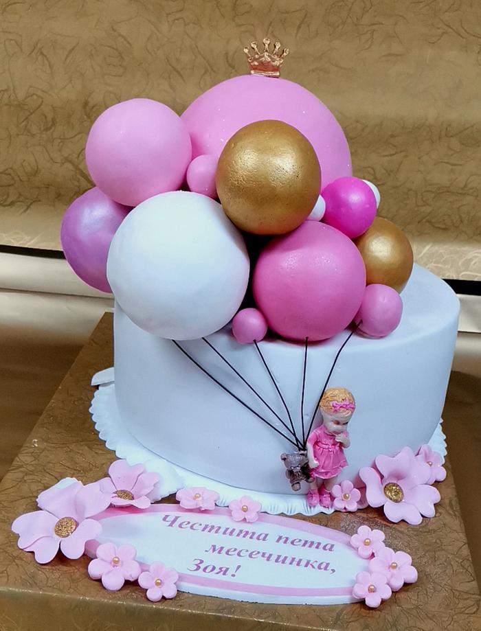 Cake with balloons and girl 