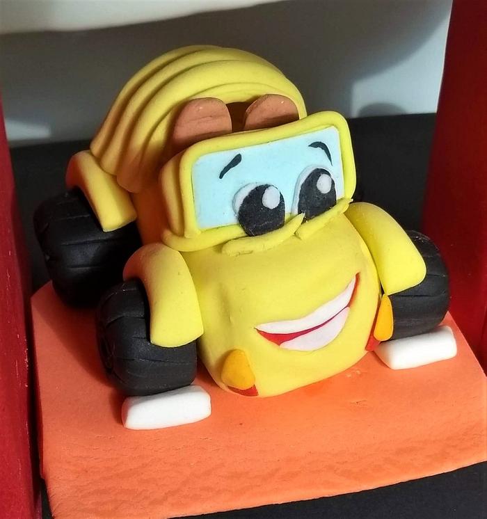 Yellow cabriolet cake topper.