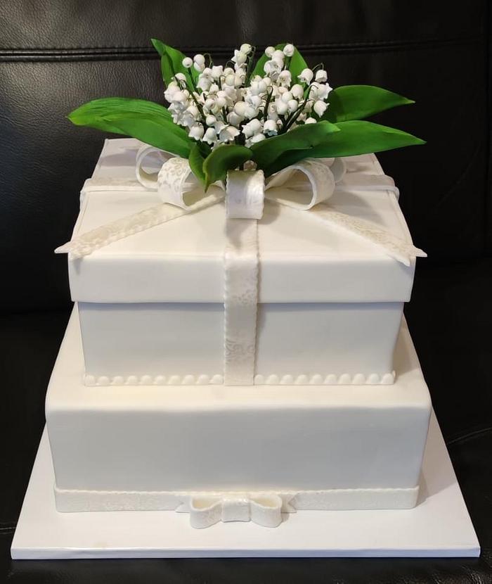 Wedding cake with sweet lilies of the valley 