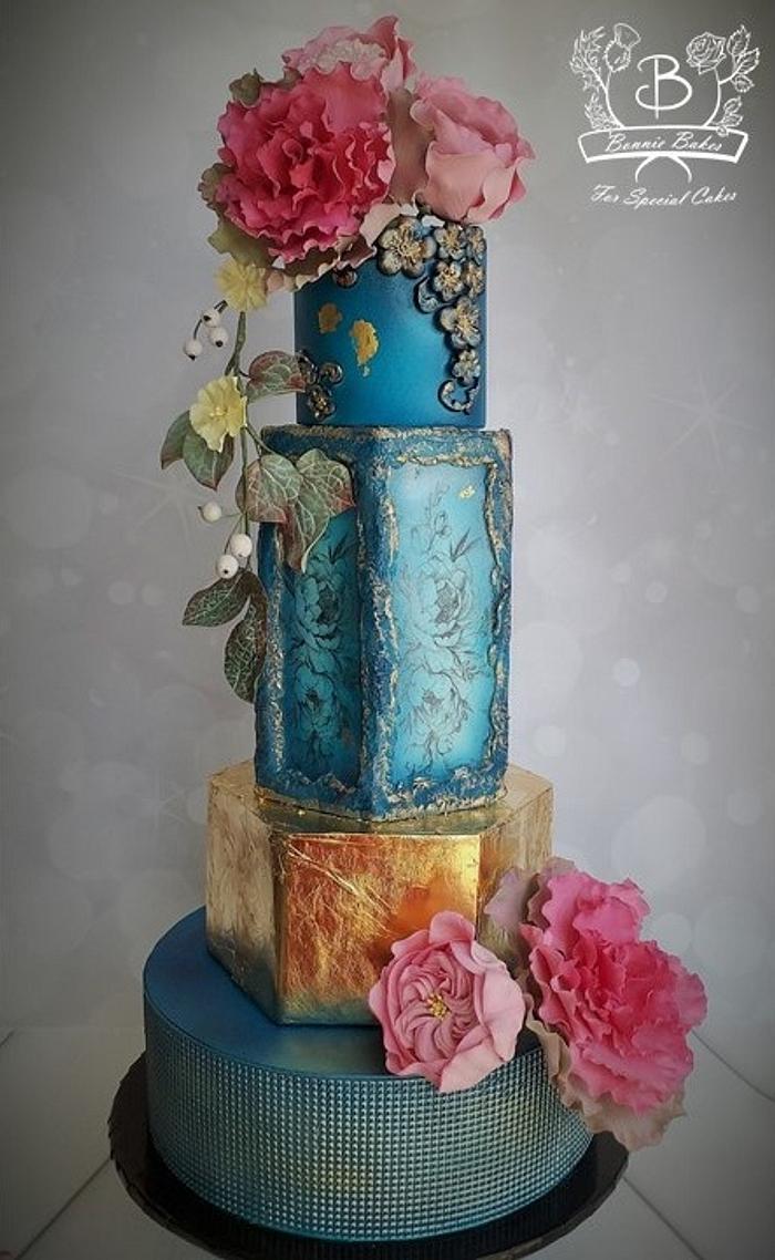 Blue and gold floral wedding cake
